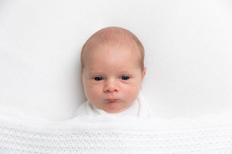 newborn swaddled for newborn photography session in their home in hampton cove alabama